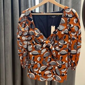 Eva Franco puff sleeve cut out top